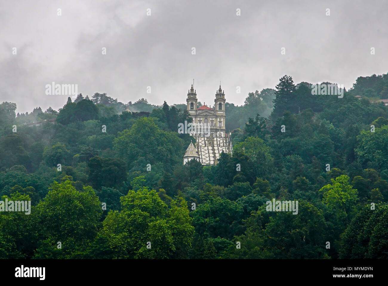 Bom Jesus do Monte church surrounded by forest and clouds. Braga. Stock Photo