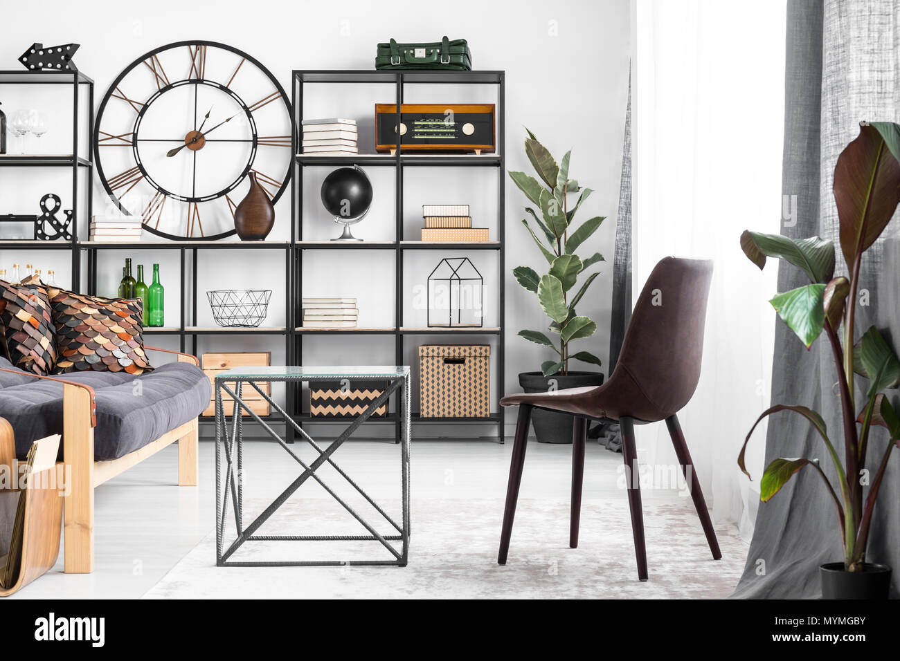 Bright Flat Interior In Industrial Style With Big Clock Potted Plants Leather Chair And Decorations Stock Photo Alamy