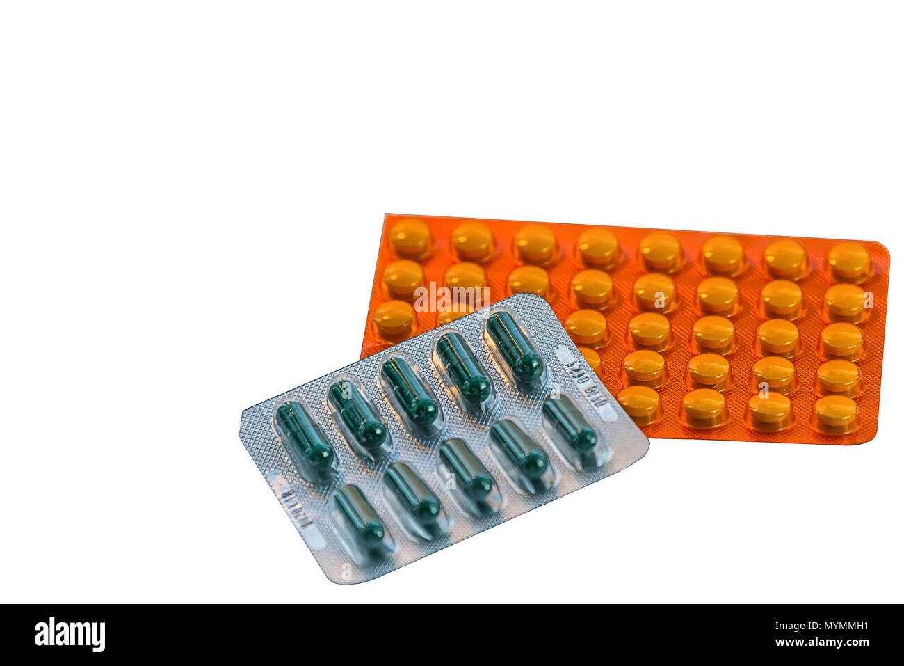 medicines are scattered on a sheet of paper, tablets in packages, means