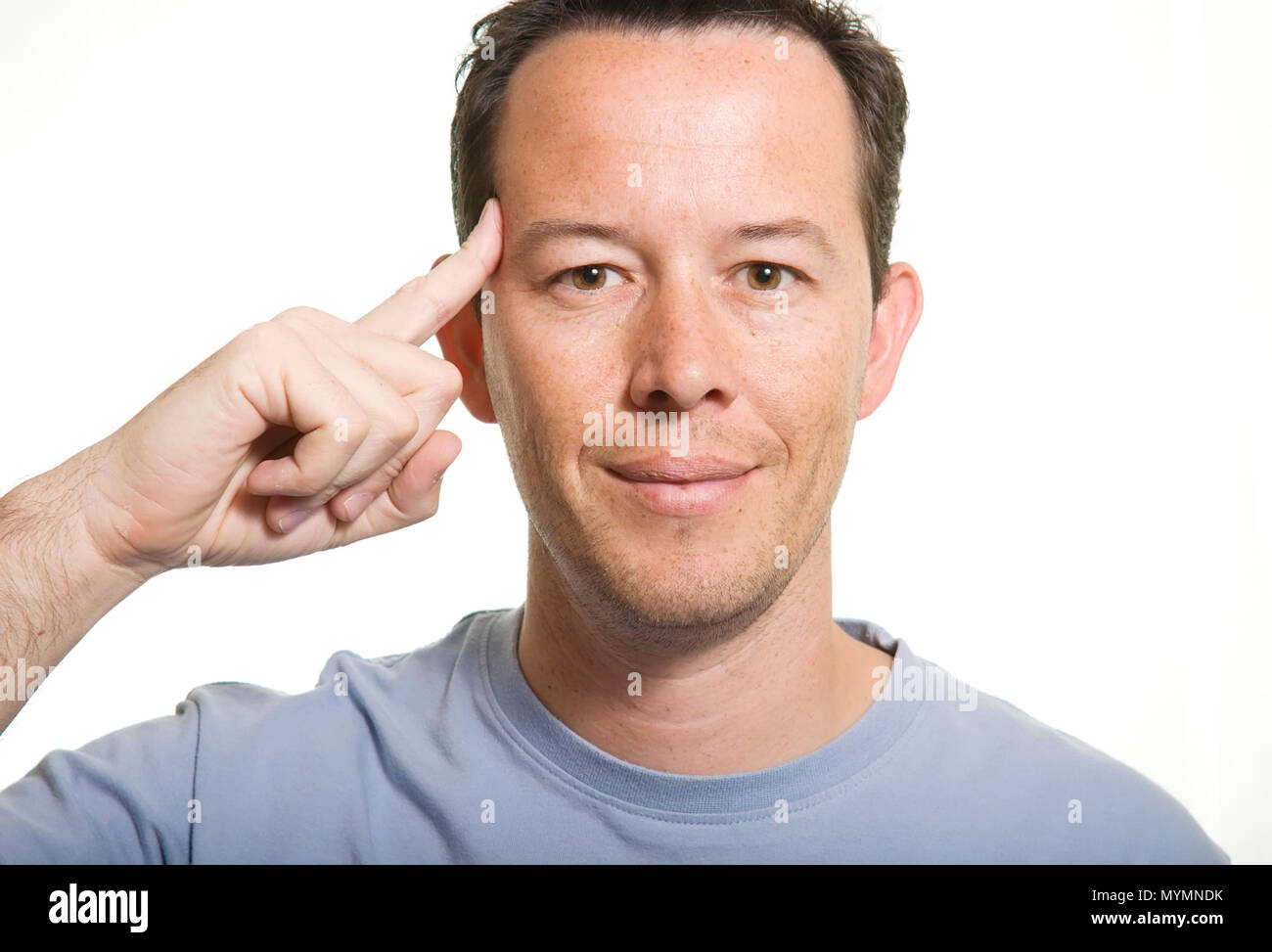 Man pointing his head with a finger Stock Photo Alamy