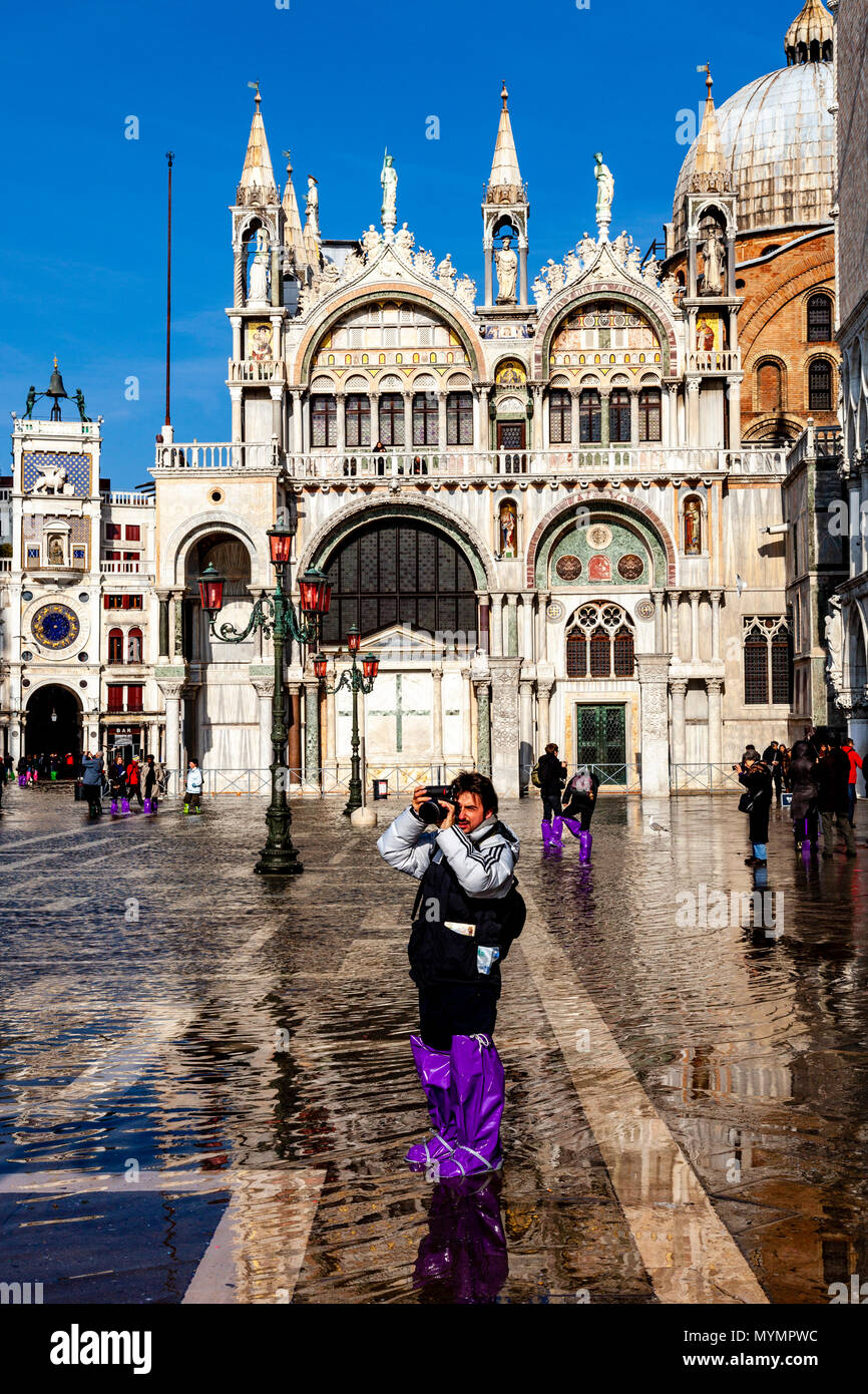 Acqua Alta (High Tide) In St Mark’s Square, Venice, Italy Stock Photo