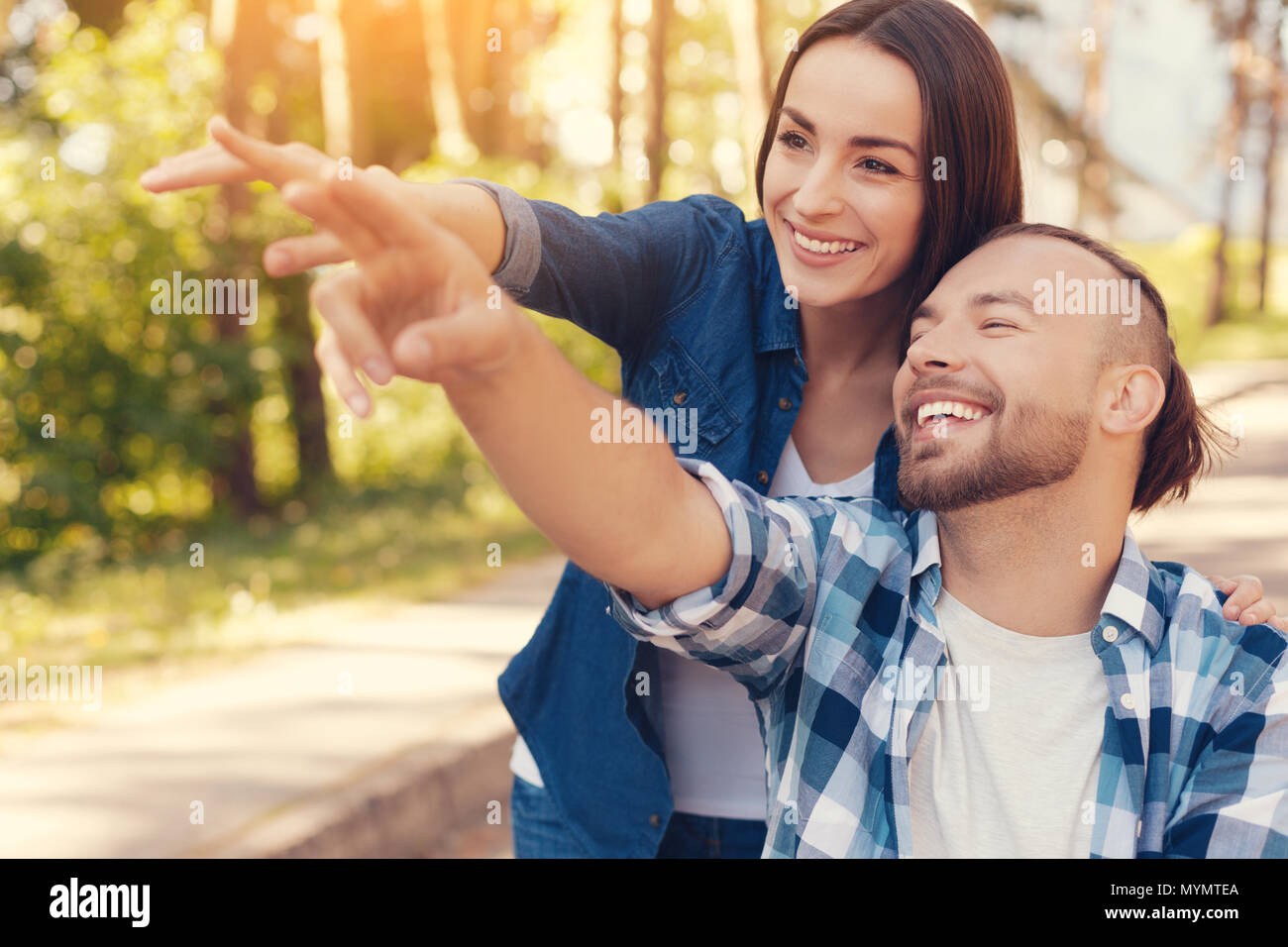 Delighted positive couple laughing Stock Photo
