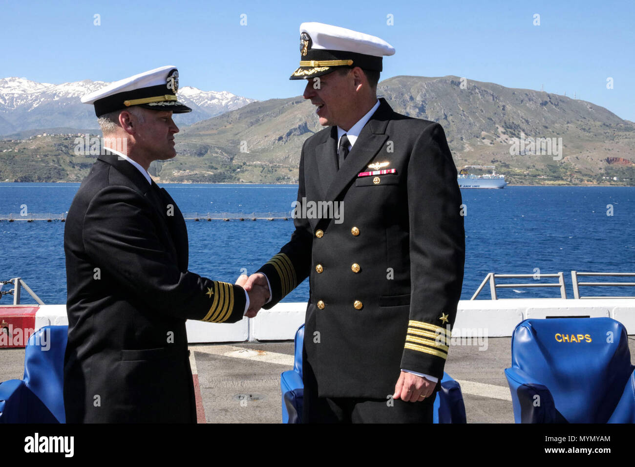 BAY, Greece (May 5, 2017) Capt. Randall Peck , left, congratulates Capt.  Maximilian Clark after being relieved as commanding officer of the San  Antonio-class amphibious transport dock ship USS Mesa Verde's (LPD