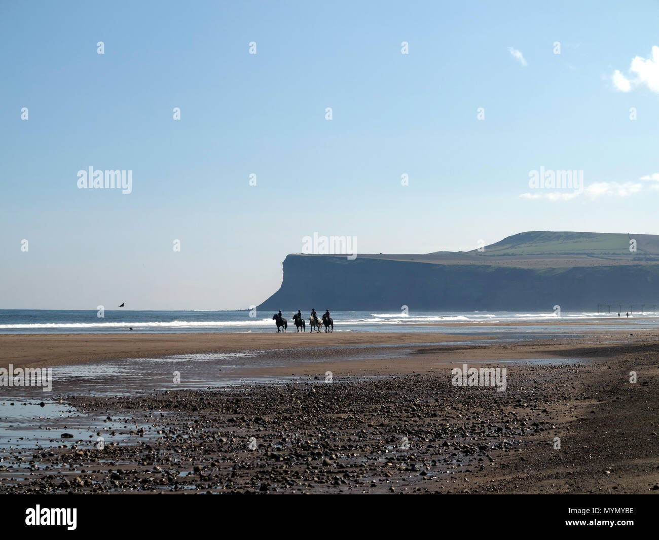 Four horseriders in Saltburn by the sea Stock Photo