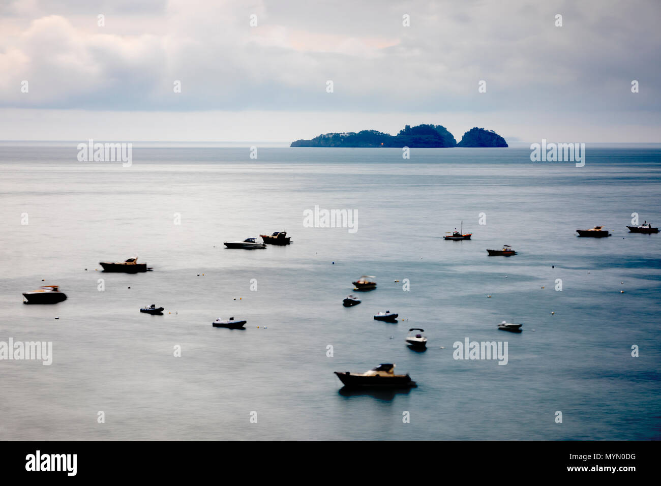 Time exposure of boats on sea and offshore islands of Gallo Lungo, Positano, The Amalfi Coast, Campania, Italy, Europe Stock Photo
