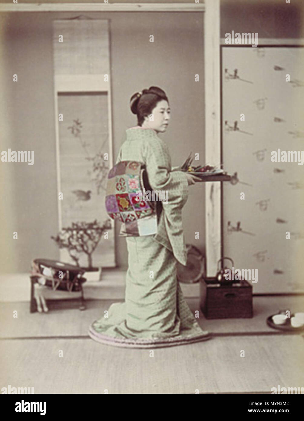 . English: albumen tinted .   Ogawa Kazumasa  (1860–1929)     Alternative names Kazumasa Ogawa; Ogawa Kazuma; Ogawa Isshin  Description Japanese photographer  Date of birth/death 29 September 1860 6 September 1929  Location of birth/death Oshi Domain (present Gyōda City) Hiratsuka, Kanagawa  Authority control  : Q3133048 VIAF: 40482349 ISNI: 0000 0000 8034 6095 ULAN: 500102435 LCCN: n79122803 NLA: 35395845 WorldCat 396 Ogawa Kazumasa - Girl Preparing for Guest Stock Photo