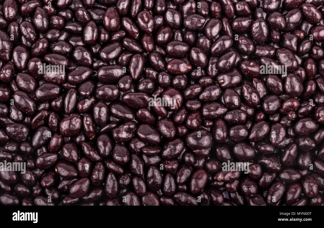 Background of the plurality of scattered sunflower seeds in chocolate Stock Photo