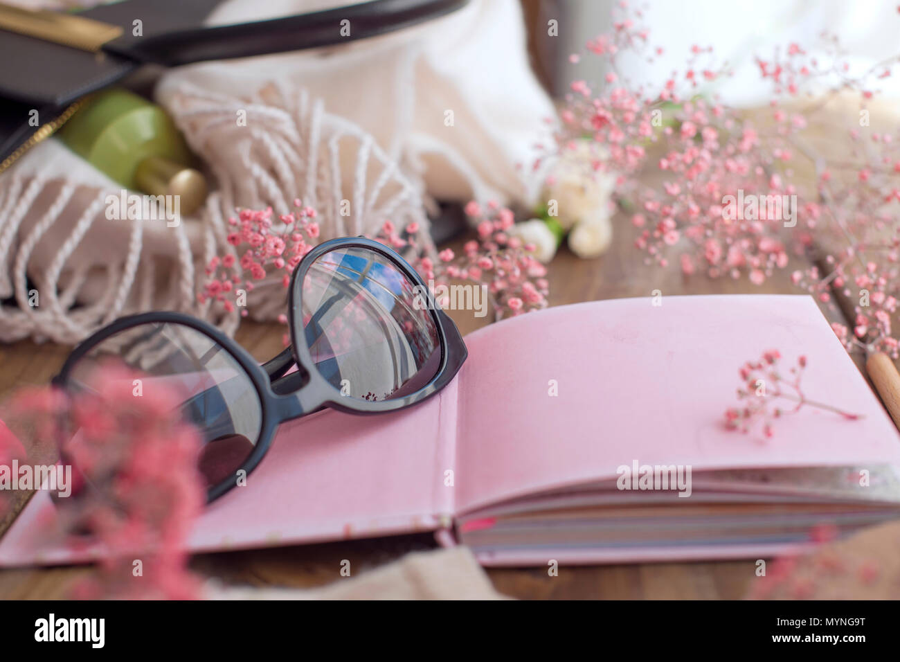 Sunglasses and a pink notebook with clean sheets. Planning. Copy space Stock Photo