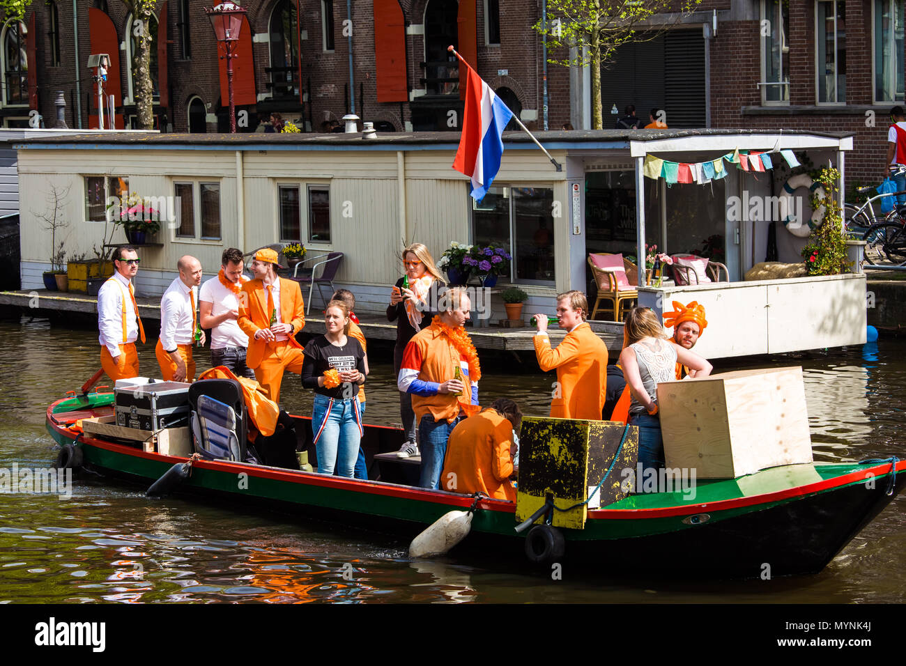 People on the boat celebrate King's day in Amsterdam city, Netherlands Stock Photo