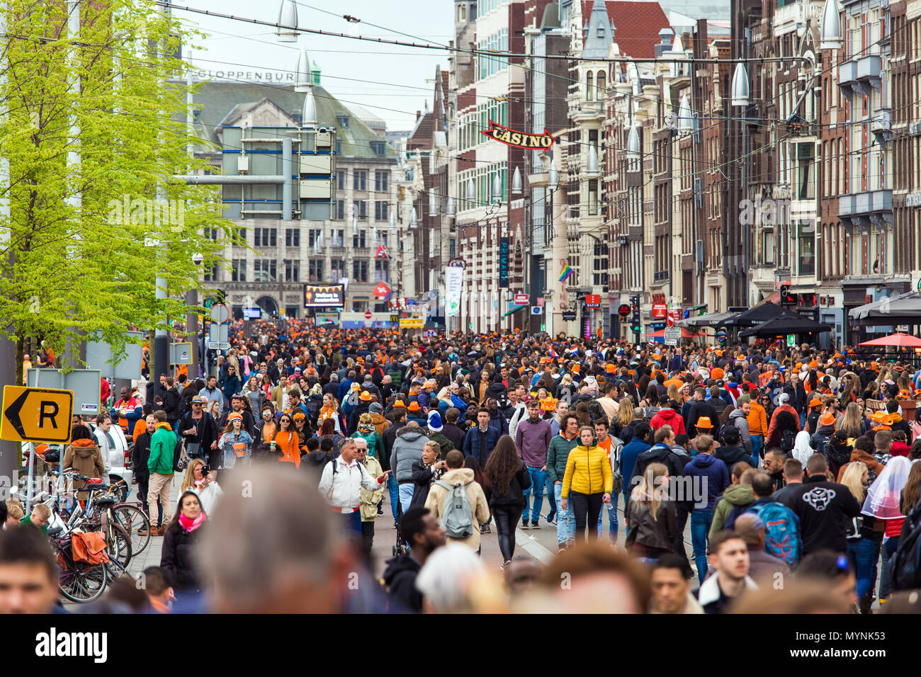 Crowd of people on the street celebrate King's day in Amsterdam city, Netherlands Stock Photo