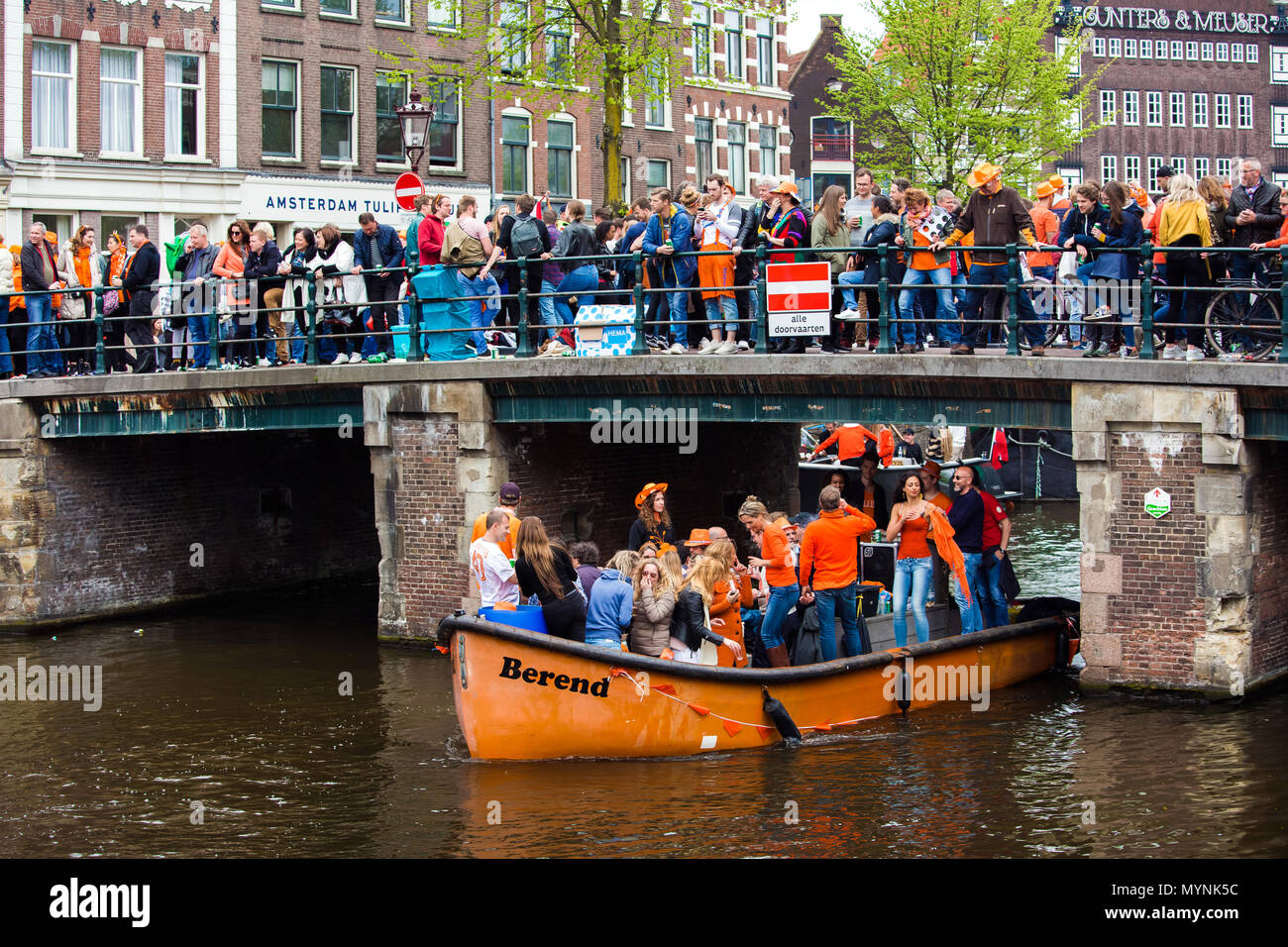 People on the boat celebrate King's day in Amsterdam city, Netherlands Stock Photo