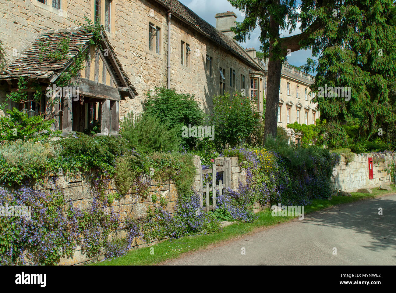 Summer time view of cotswold cottage with half timbered porch, summer