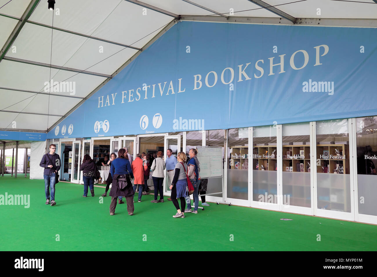 Visitors standing outside the Hay Festival Bookshop where authors and readers meet for book signing and buying books Hay-on-Wye Wales UK  KATHY DEWITT Stock Photo