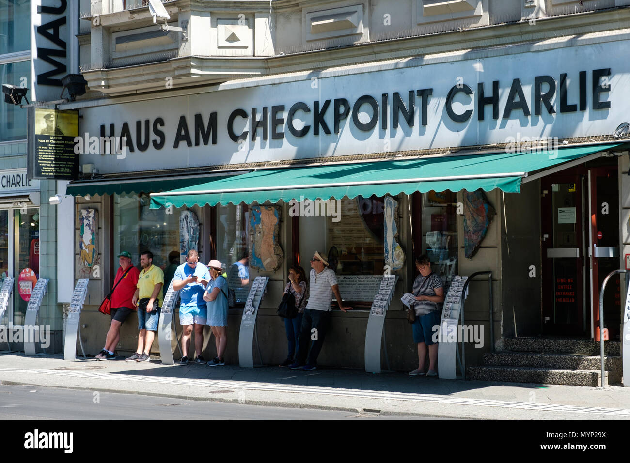 Berlin, Germany - june 2018: People in front of Haus am Checkpoint Charlie / Berlin wall museum  at former border of east and west Berlin Stock Photo