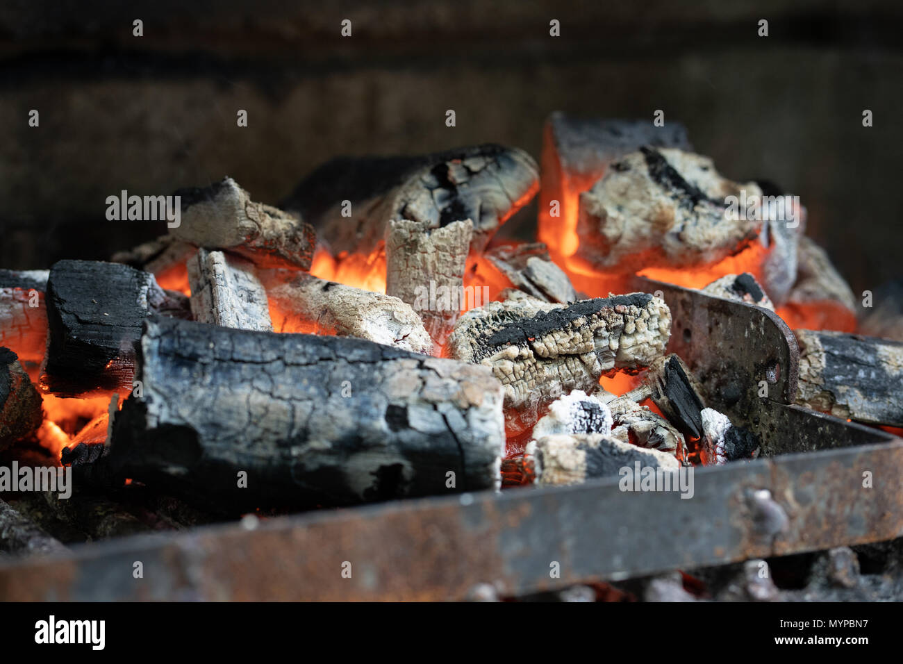 Glowing coal during a barbeque in summer Stock Photo