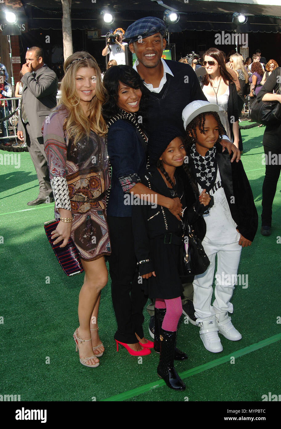 Fergie posing with Will Smith with wife Jada Pinkett-Smith and son Jaden and daughter Willow - Madagascar: Escape 2 Africa Premiere at the Westwood Village Theatre In Los Angeles. 01 SmithWill Jada kids Fergie 01  Event in Hollywood Life - California, Red Carpet Event, USA, Film Industry, Celebrities, Photography, Bestof, Arts Culture and Entertainment, Celebrities fashion, Best of, Hollywood Life, Event in Hollywood Life - California, Red Carpet and backstage, Music celebrities, Topix, Couple, family ( husband and wife ) and kids- Children, brothers and sisters inquiry tsuni@Gamma-USA.com, Cr Stock Photo