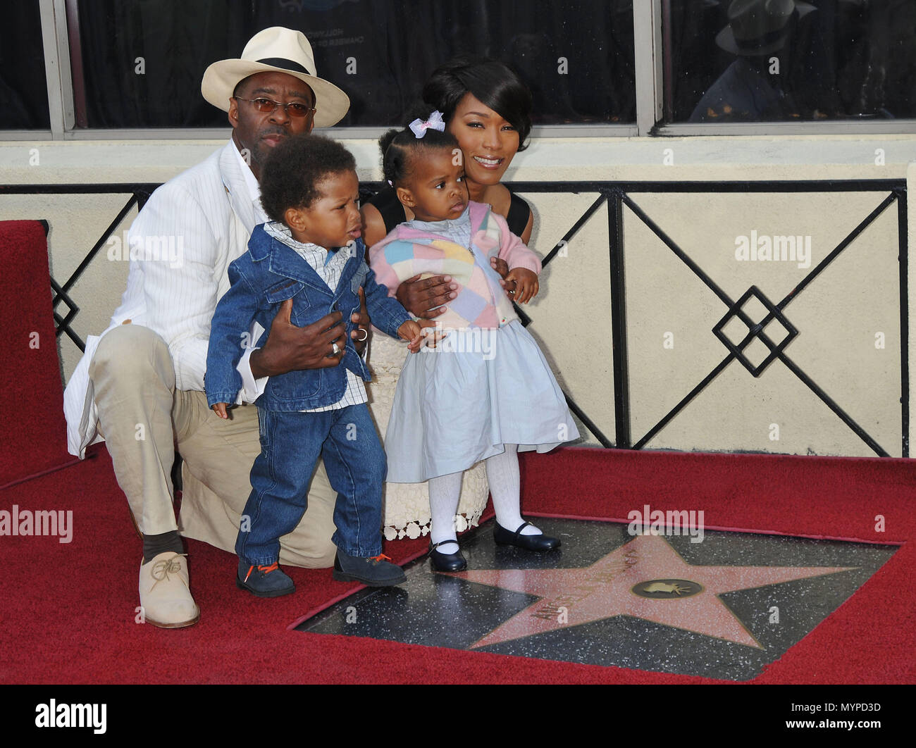 Angela Bassett, Courtney Vance, Bronwyn Golden and Slater Josiah, -  Angela Bassett Honored with a Star on the Hollywood Walk Of Fame In Los Angeles.  family picture full length eye contact smile 03 BassettAngela VanceC kids 03  Event in Hollywood Life - California, Red Carpet Event, USA, Film Industry, Celebrities, Photography, Bestof, Arts Culture and Entertainment, Celebrities fashion, Best of, Hollywood Life, Event in Hollywood Life - California, Red Carpet and backstage, Music celebrities, Topix, Couple, family ( husband and wife ) and kids- Children, brothers and sisters inquiry tsuni@Ga Stock Photo