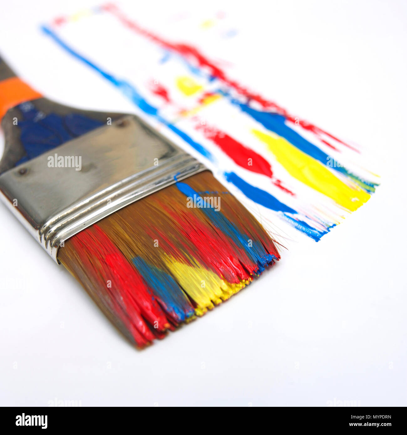 Paint brushe and multicolored painting Stock Photo