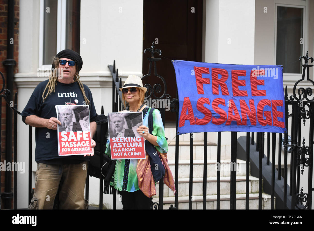 Supporters of Julian Assange outside the Ecuadorian Embassy in London as representatives from the Australian High Commission has visited the WikiLeaks founder. Stock Photo