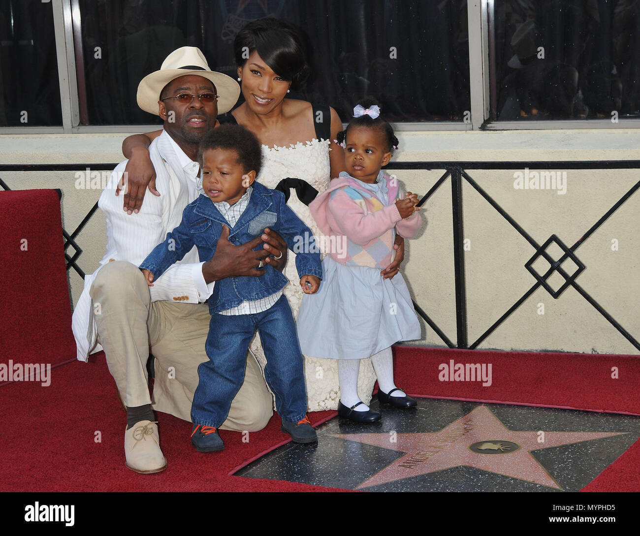 Angela Bassett, Courtney Vance, Bronwyn Golden and Slater Josiah, -  Angela Bassett Honored with a Star on the Hollywood Walk Of Fame In Los Angeles.  family picture full length eye contact smile 07 BassettAngela VanceC kids 07  Event in Hollywood Life - California, Red Carpet Event, USA, Film Industry, Celebrities, Photography, Bestof, Arts Culture and Entertainment, Celebrities fashion, Best of, Hollywood Life, Event in Hollywood Life - California, Red Carpet and backstage, Music celebrities, Topix, Couple, family ( husband and wife ) and kids- Children, brothers and sisters inquiry tsuni@Ga Stock Photo