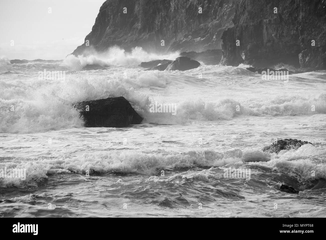 Storm waves overwhelm a rock off Cape Meares, Tillamook County, Oregon. Stock Photo
