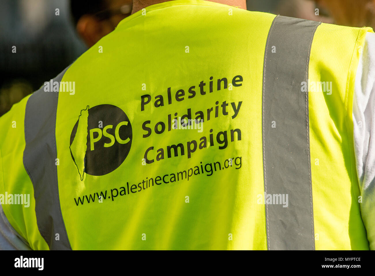 PSC marshall at the Gaza: Stop The Massacre rally in Whitehall, London, in protest of Palestinian civilians killed by Israeli military. Stock Photo