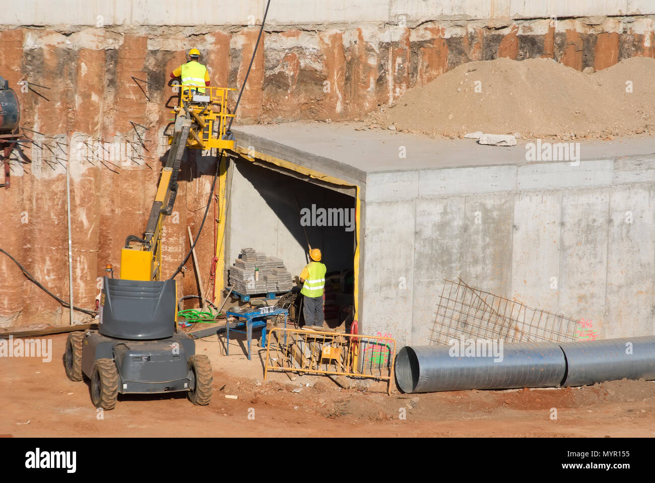 Workers working outdoors in a constrution Stock Photo