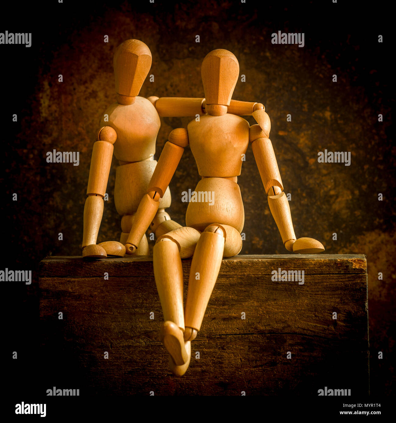 Mannequins on a wooden box, concept love Stock Photo