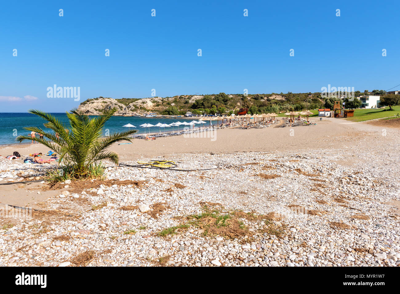 Sandy beach in Kolymbia village on Rhodes island. Greece Stock Photo