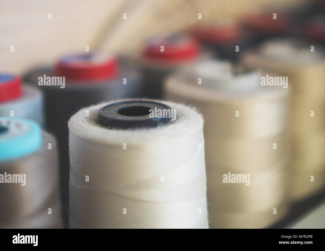 A collection of sewing threads. Close-up view Stock Photo - Alamy