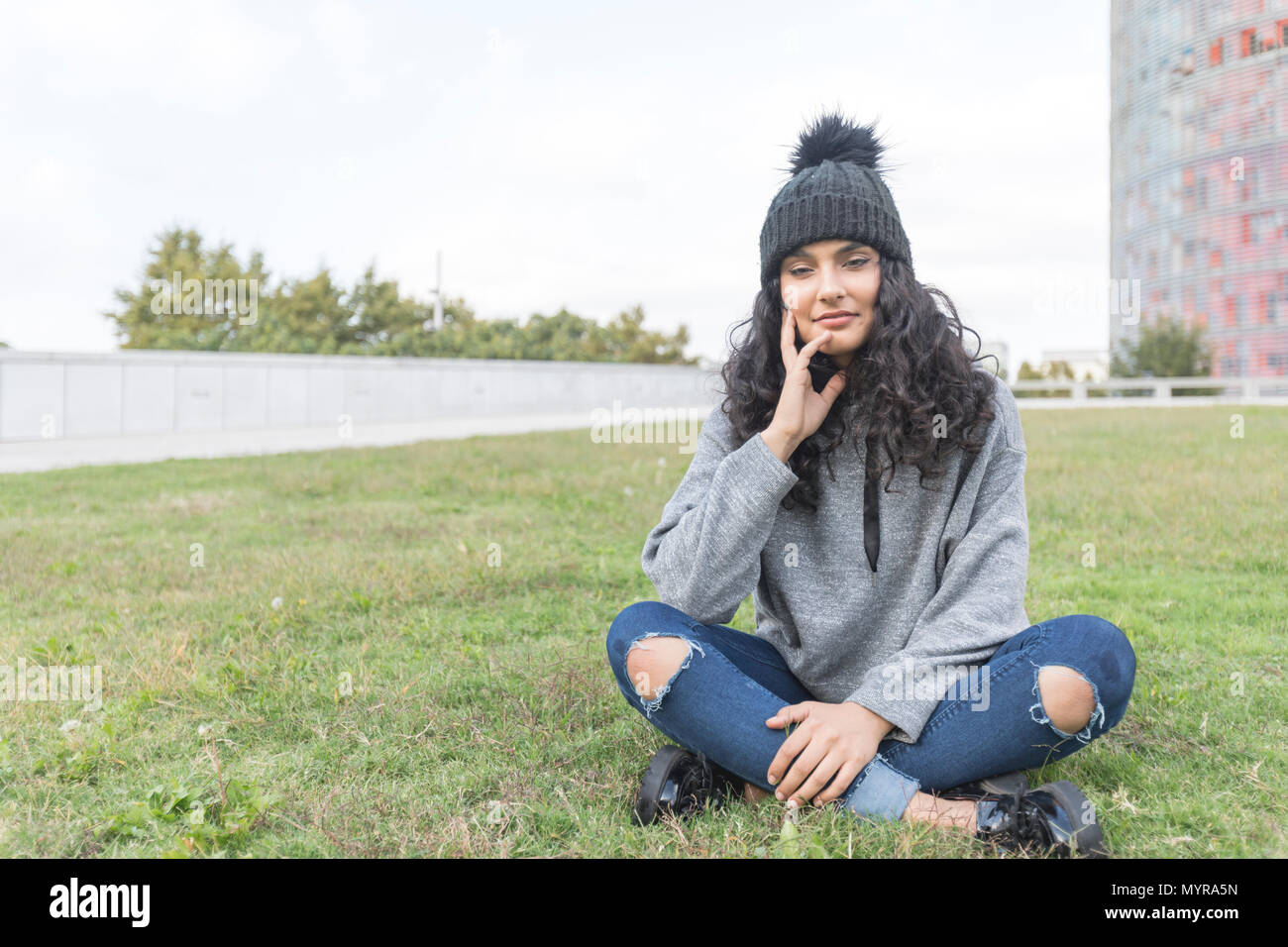One young woman beach thinking wool hi-res stock photography and images ...