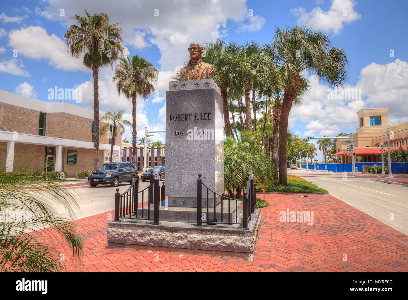 Fort Myers, Florida, USA – June 7, 2018: Clouds form in a blue sky above the controversial Robert E. Lee monument in downtown Fort Myers, Florida. Edi Stock Photo