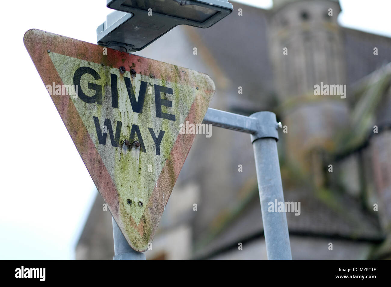 A dirty give way sign Stock Photo