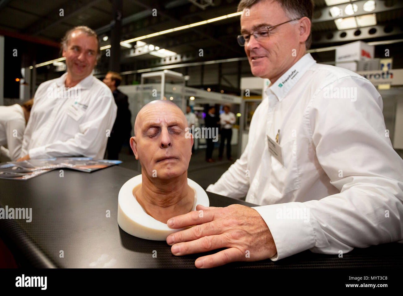 05 June 2018, Germany, Erfurt: Markus Lingner (R) of 'Fraunhofer-Allianz Generative Fertigung', an alliance of institutes for the research, development and implementation of generative manufacturing processes and methods, holds a bust from a 3D printer in his hands during the 15th Rapid.Tech   FabCon 3.D Fair. The fair, with companies presenting the latest products and applications in generative manufacturing and 3D printing, runs from 5 June to 7 June 2018. Photo: Christoph Soeder/dpa Stock Photo