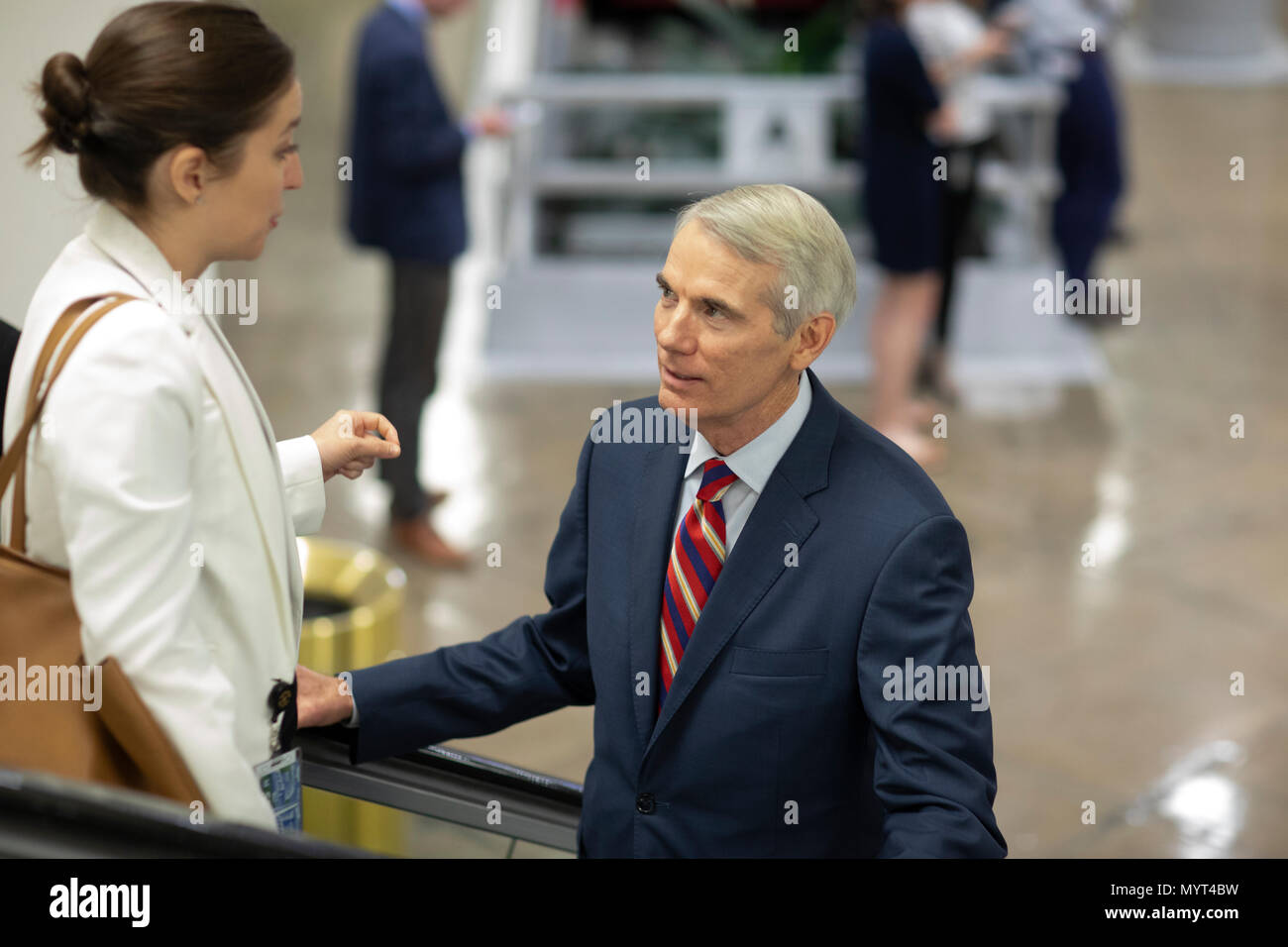 United States Senator Rob Portman, Republican of Ohio talks with a staffer in the Senate Subway during a Senate vote on Capitol Hill in Washington, DC on July 7, 2018. Credit: Alex Edelman/CNP /MediaPunch Stock Photo