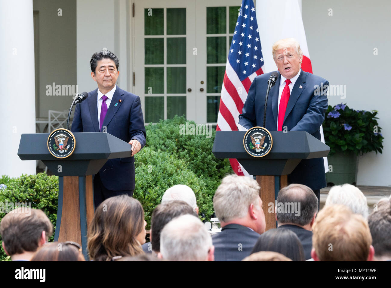 President Donald Trump and Shinzo Abe, the Prime Minister of Japan, in the Rose Garden at the White House. US President Donald Trump and Japan's Prime Minister Shinzo Abe take part in a joint press conference in the Rose Garden of the White House. Stock Photo
