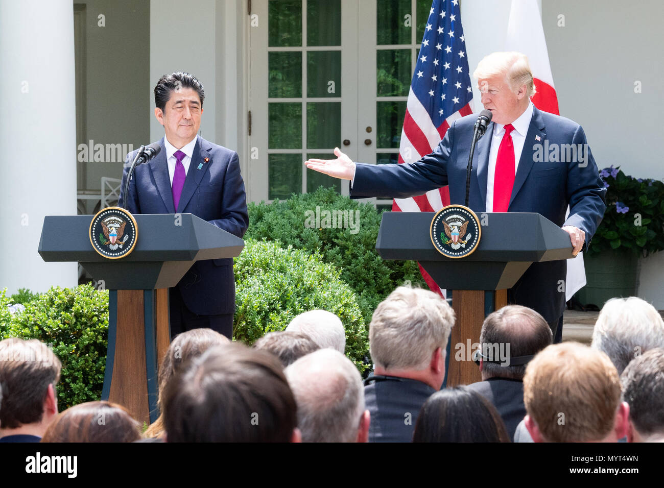 President Donald Trump and Shinzo Abe, the Prime Minister of Japan, in the Rose Garden at the White House. US President Donald Trump and Japan's Prime Minister Shinzo Abe take part in a joint press conference in the Rose Garden of the White House. Stock Photo