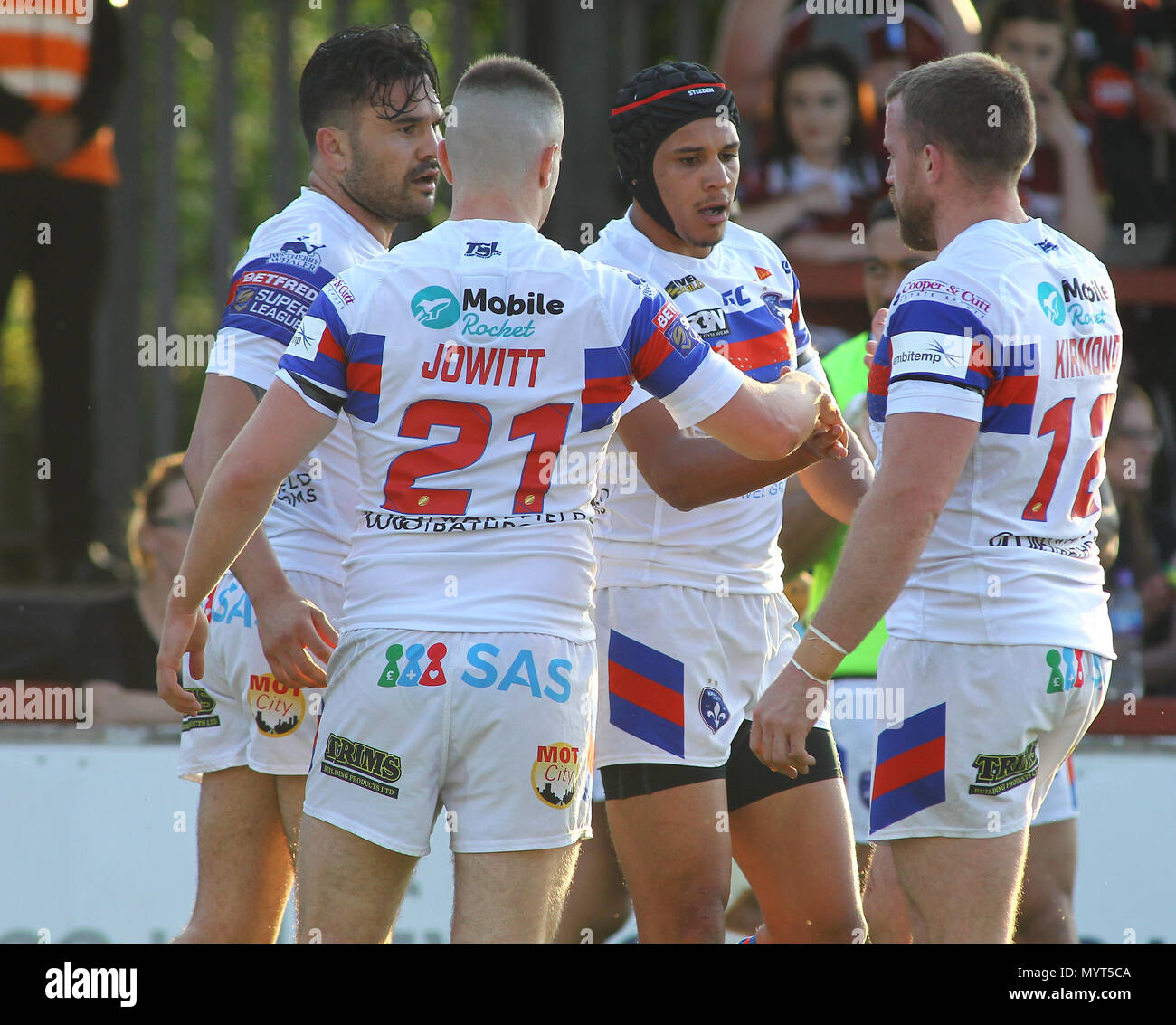 Wakefield, UK. Thursday 7th June 2018 , Mobile Rocket Stadium, Wakefield, England; Betfred Super League, Wakefield Trinity v Wigan Warriors; Ben Jones-Bishop (C) of Wakefield Trinity celebrates scoring his 1st try of the game with team mates Max Jowitt (L) and Danny Kirmond (R) Credit: News Images /Alamy Live News Stock Photo