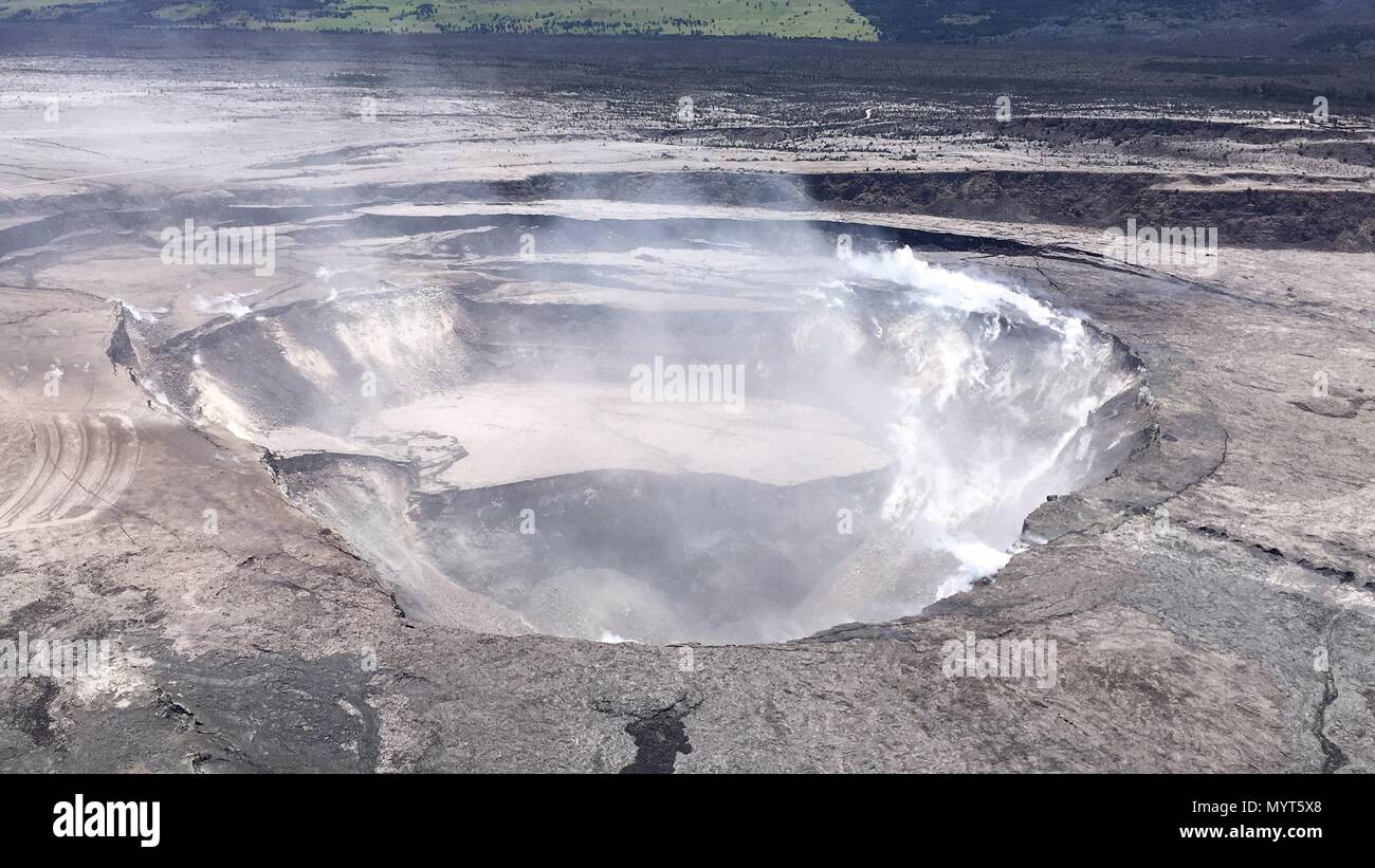 Hawaii, USA. 6th June, 2018. Aerial view of the Halemaumau crater showing collapse of the crater walls enlarging the caldera and deflating the lava lake which once filled the space caused by the eruption of the Kilauea volcano June 6, 2018 in Hawaii. The recent eruption continues destroying homes, forcing evacuations and spewing lava and poison gas on the Big Island of Hawaii. Credit: Planetpix/Alamy Live News Stock Photo