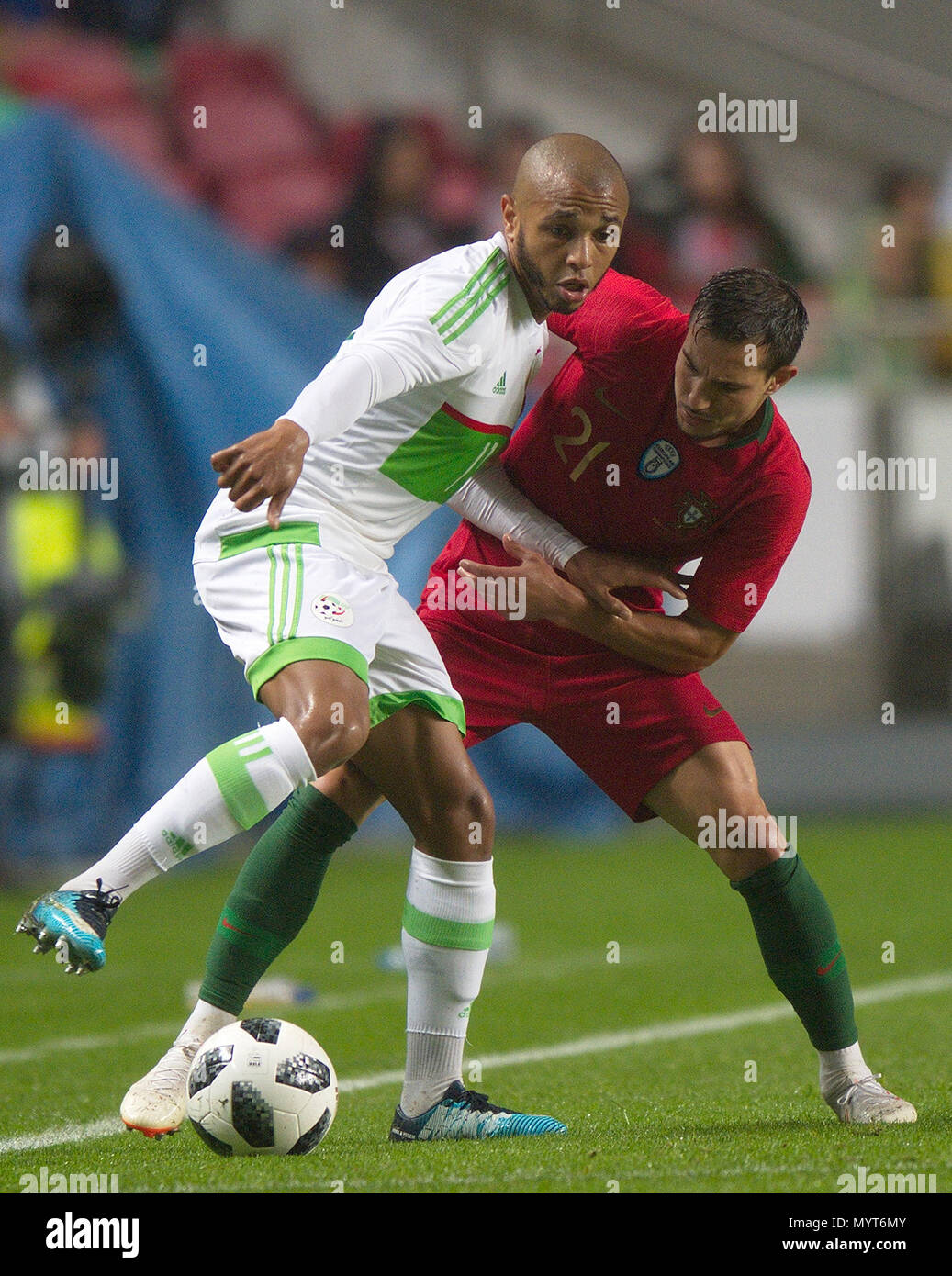 Lisbon, Portugal. 7th June, 2018. Cedric Soares (R) of Portugal vies with Yacine Brahimi of Algeria during the international friendly soccer match between Portugal and Algeria at Luz Stadium in Lisbon, Portugal, on June 7, 2018. Portugal won 3-0. Credit: Zhang Liyun/Xinhua/Alamy Live News Stock Photo