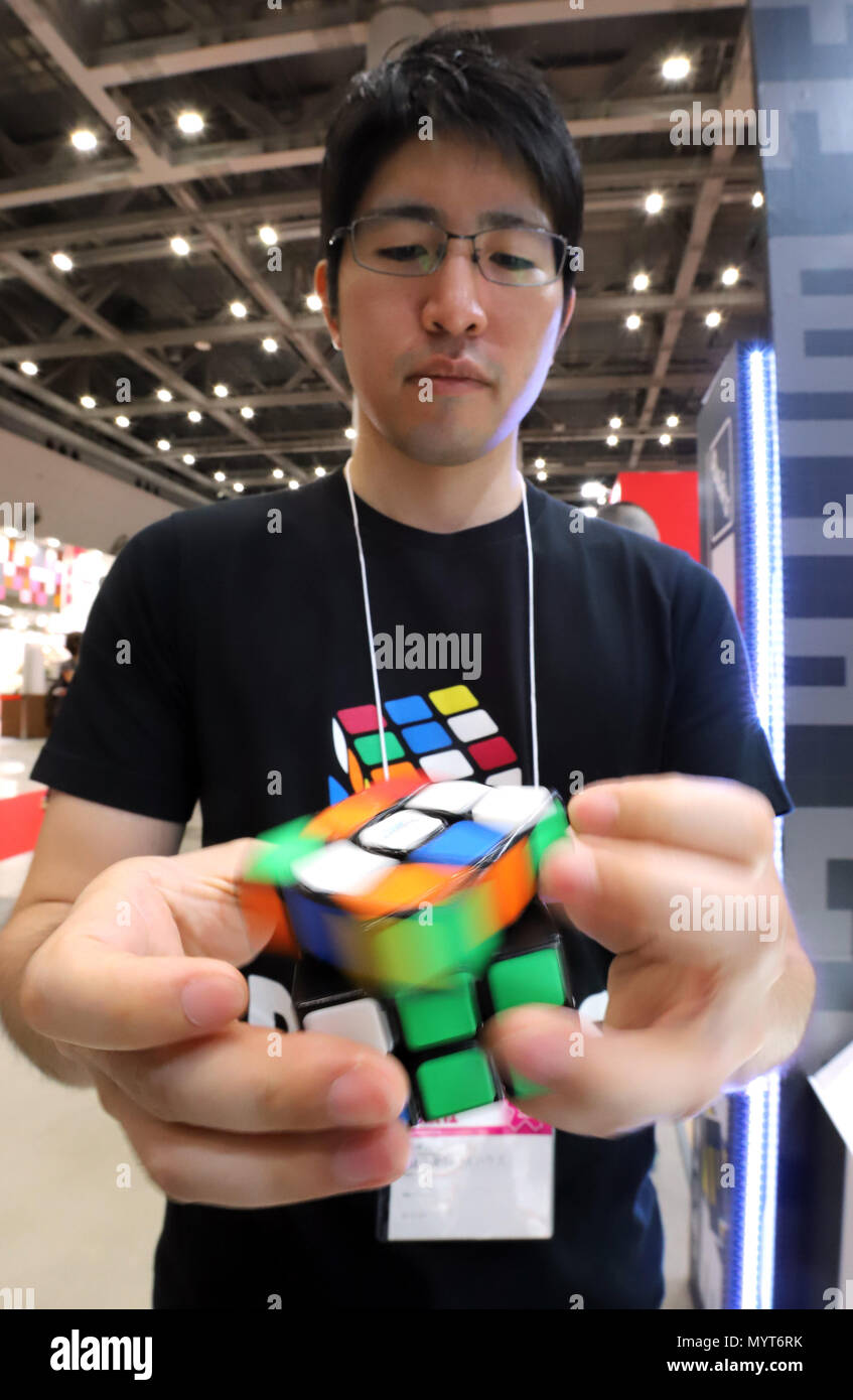 Tokyo, Japan. 7th June, 2018. Former Rubiks Cube world champion Yu Nakajima  displays a high performance model of Rubiks Cube "Rubiks Speed Cube" by  Japanese toy maker Mega House at the annual