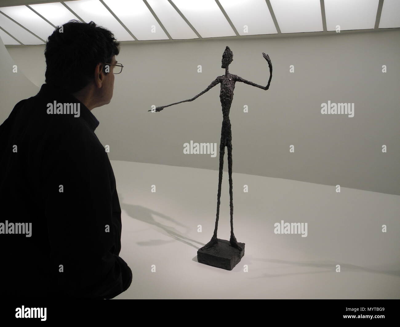 07 June 2018, US, New York: The sculpture 'Man Pointing' by Swiss artist Alberto Giacometti in the grand retrospective 'Giacometti' in the Guggenheim Museum. The exhibition with almost 200 works opens on Friday. Photo: Johannes Schmitt-Tegge/dpa Stock Photo