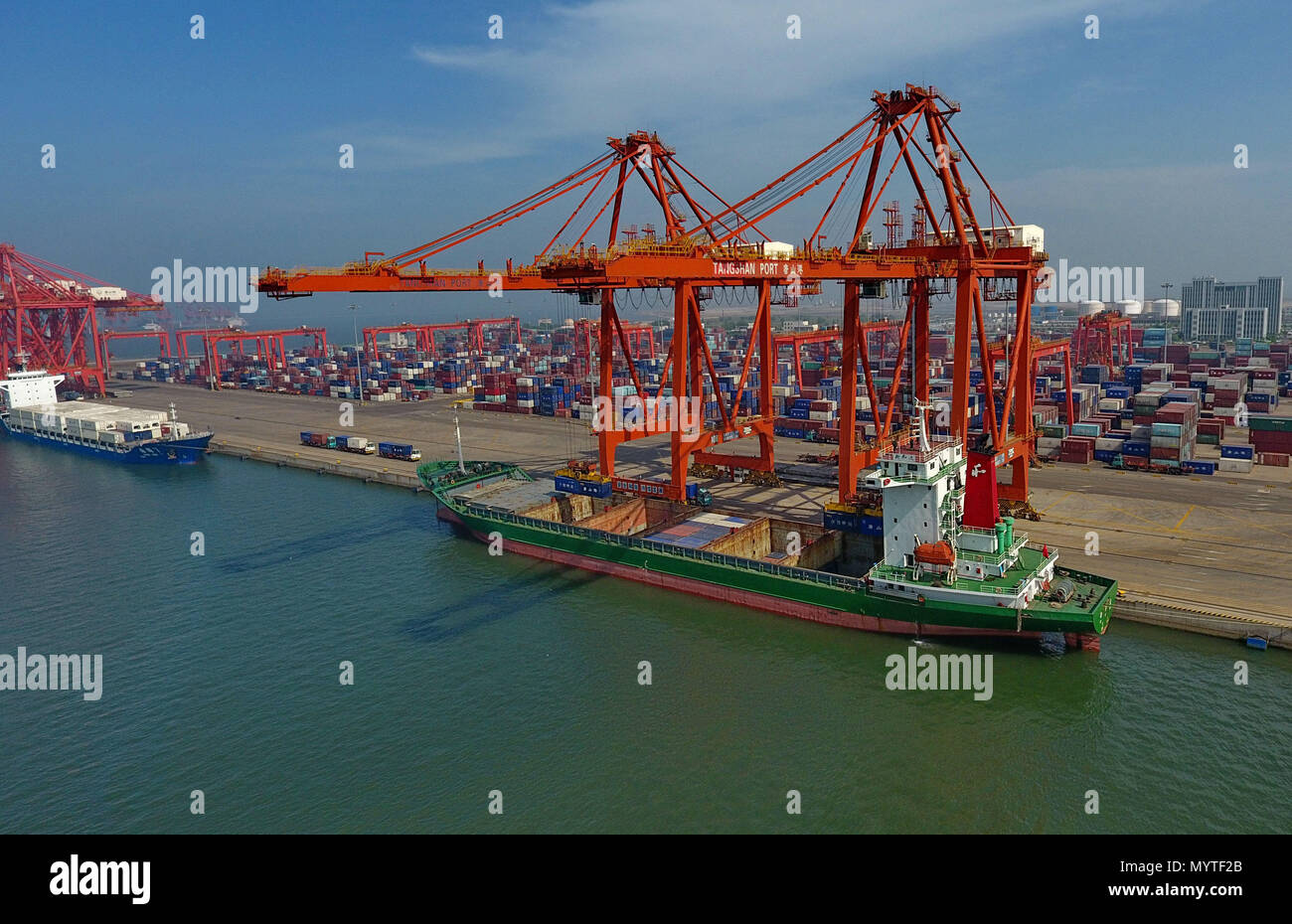 Tangshan. 7th June, 2018. Aerial photo taken on June 7, 2018 shows a  container dock of Tangshan Port in north China's Hebei Province. The total  cargo throughput of Tangshan Port reached 247
