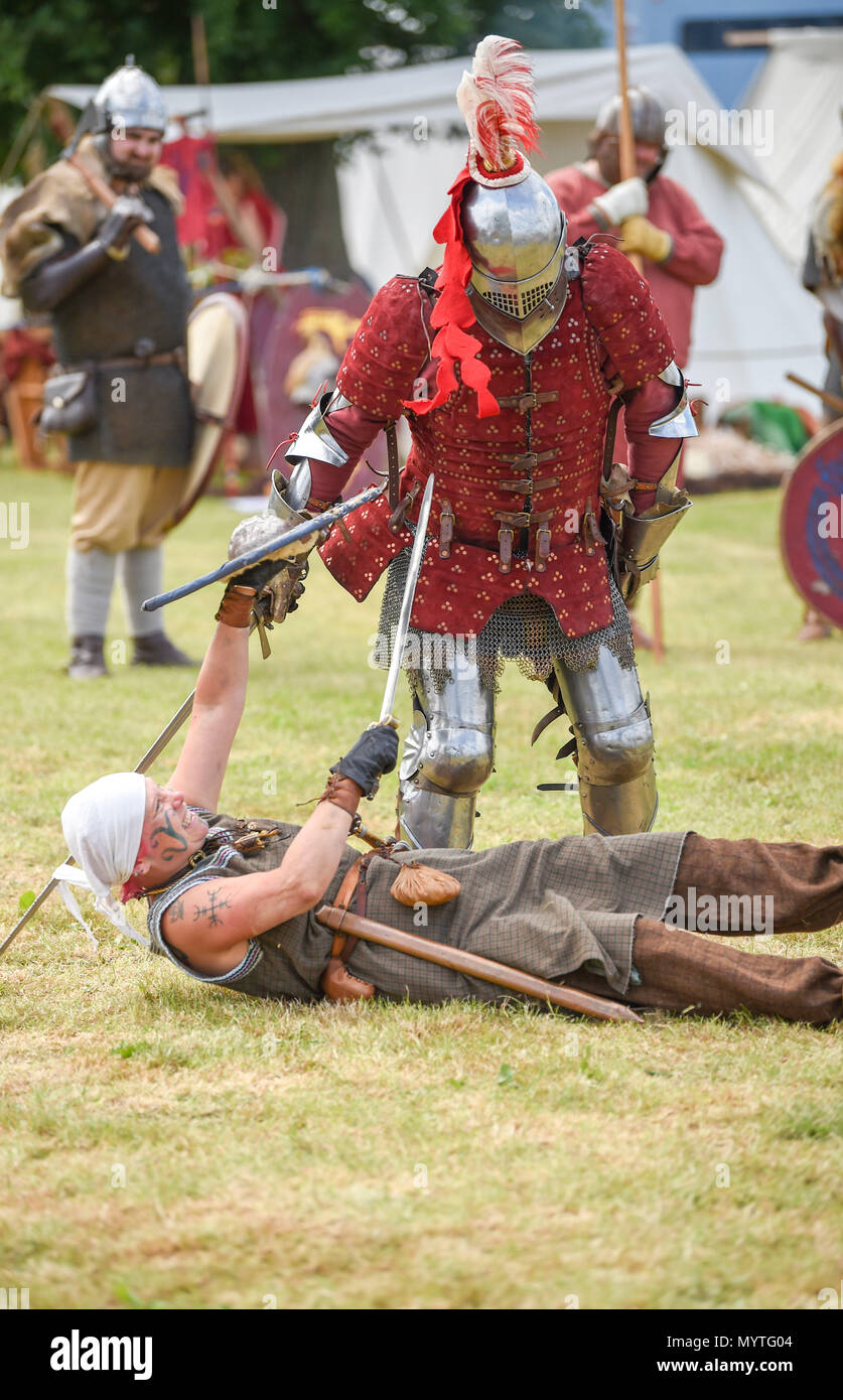 Ardingly Sussex UK 8th June 2018 - A mixture of Saxon and Medieval soldiers battling it out at the South of England Show in beautiful sunny weather held at the Ardingly Showground near Haywards Heath Sussex Photograph by Simon Dack Credit: Simon Dack/Alamy Live News Stock Photo