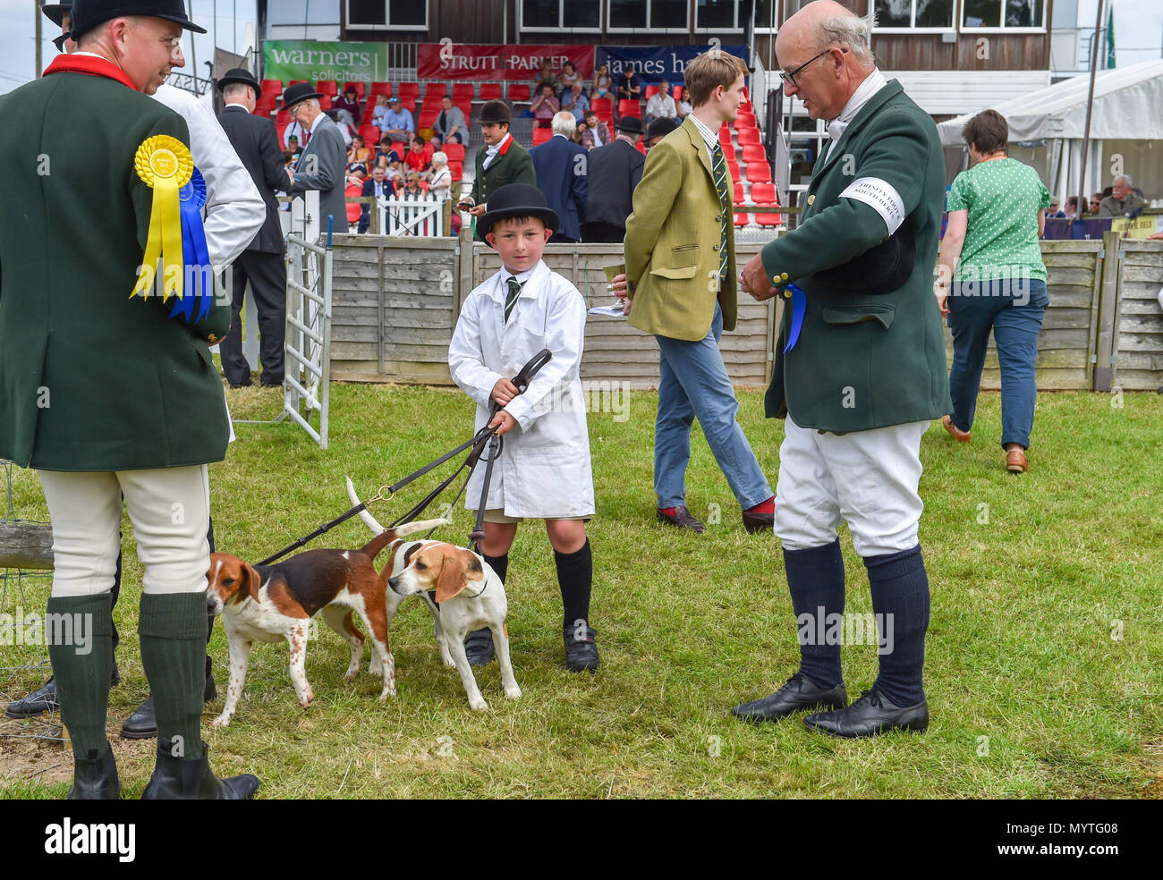 Ardingly Sussex UK 8th June 2018 - 8 year old Jack Higgs from the Trinity Foot & South Herts hounds competing with his father Matthew (right) at the South of England Show in beautiful sunny weather held at the Ardingly Showground near Haywards Heath Sussex Photograph by Simon Dack Credit: Simon Dack/Alamy Live News Stock Photo