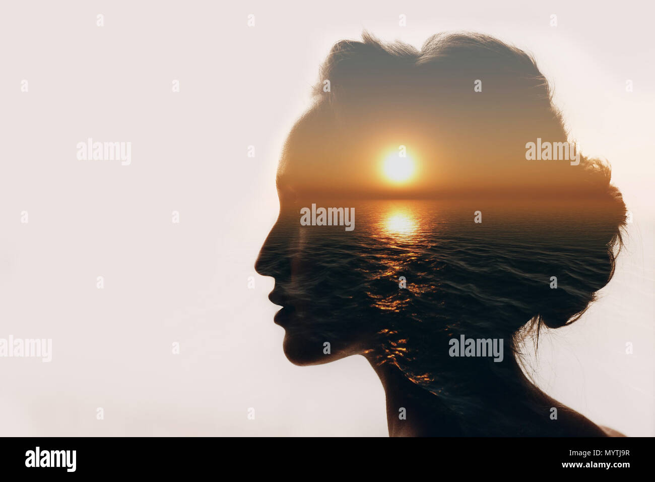 Psychology concept. Sunrise and woman silhouette. Stock Photo