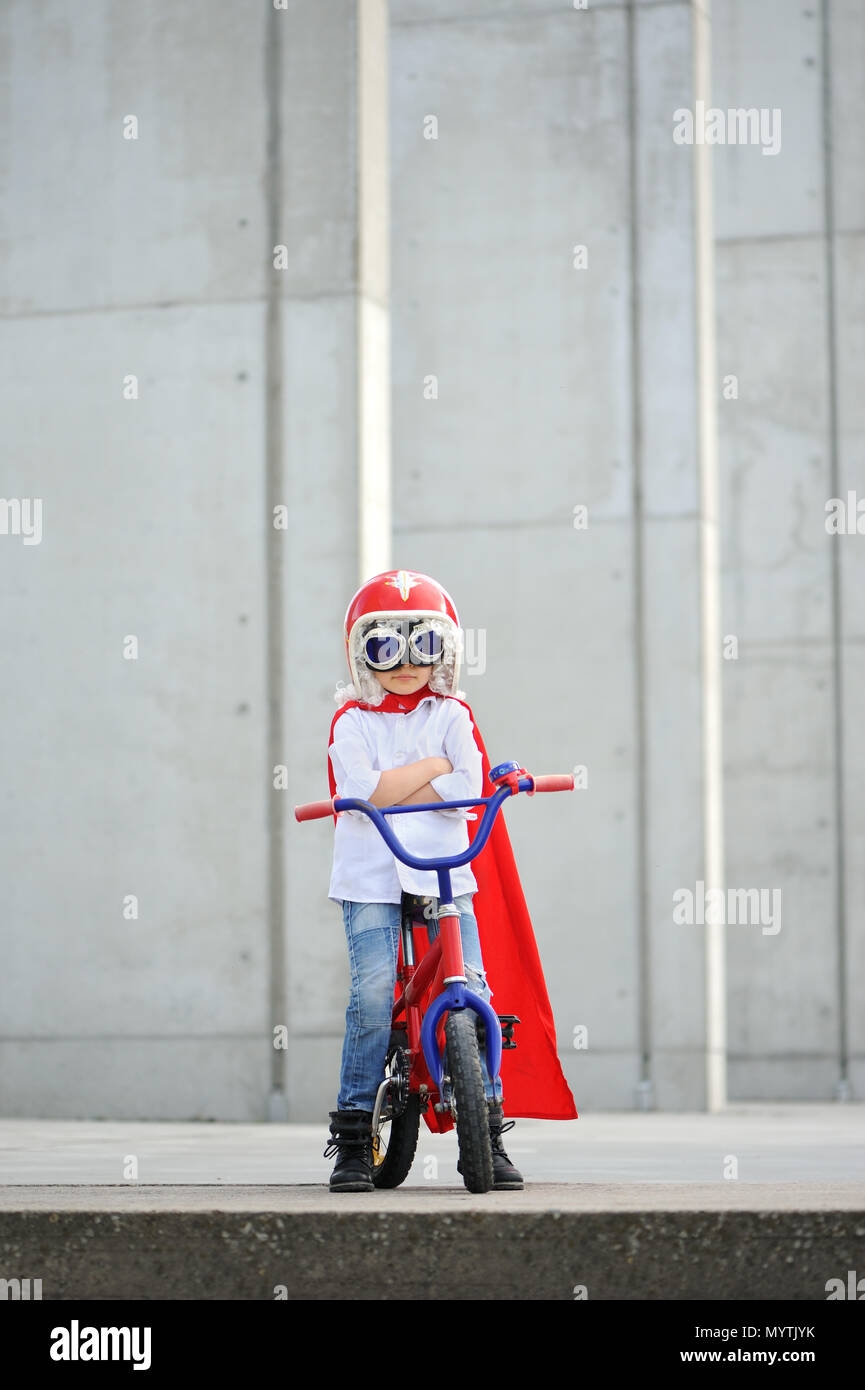 A funny, little superhero. Concept boy imagination. Happy childchood. Stock Photo