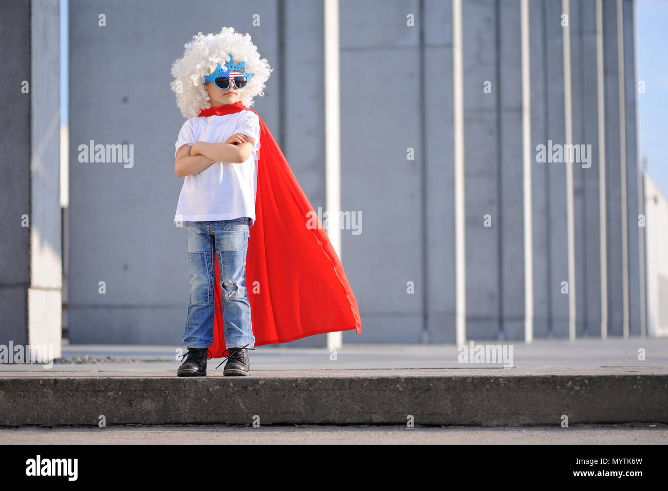 A funny, little superhero. Concept boy imagination. Happy childchood. Stock Photo