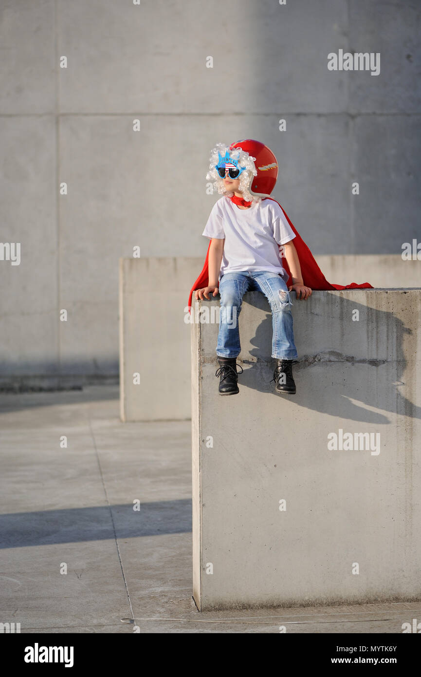 A funny, little superhero. Concept boy imagination. Happy childchood. Stock Photo