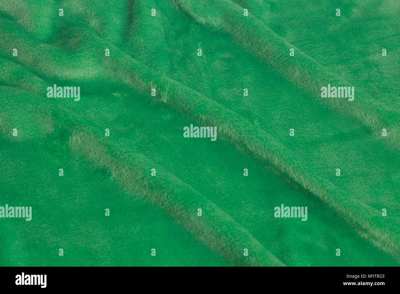 Green velvet fabric background texture close up Stock Photo - Alamy
